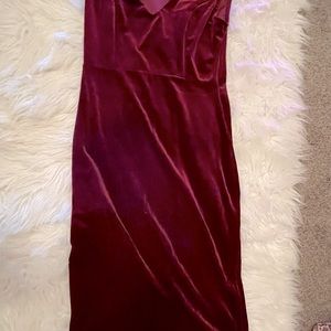 A short red velvet dress with an open chest